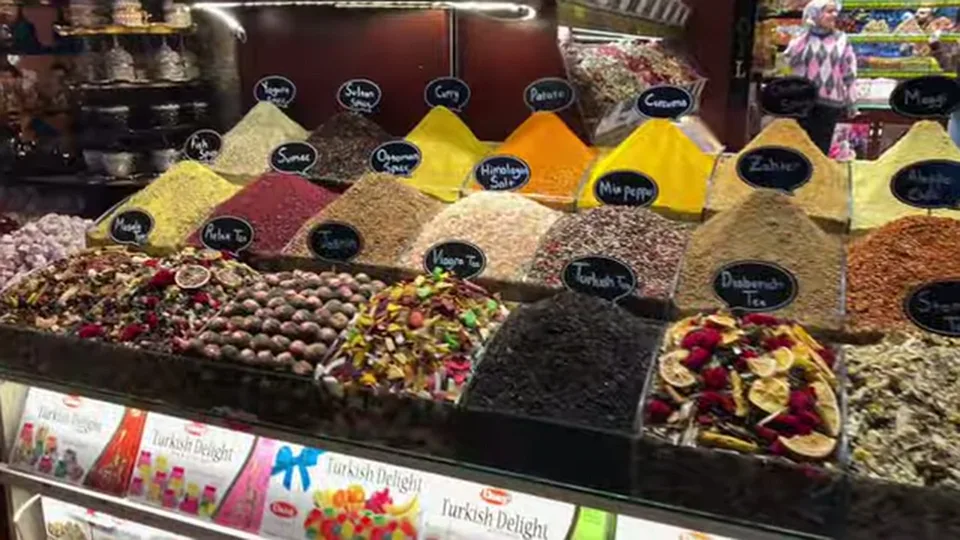 Neatly labeled spice and tea mounds inside the Spice Bazaar